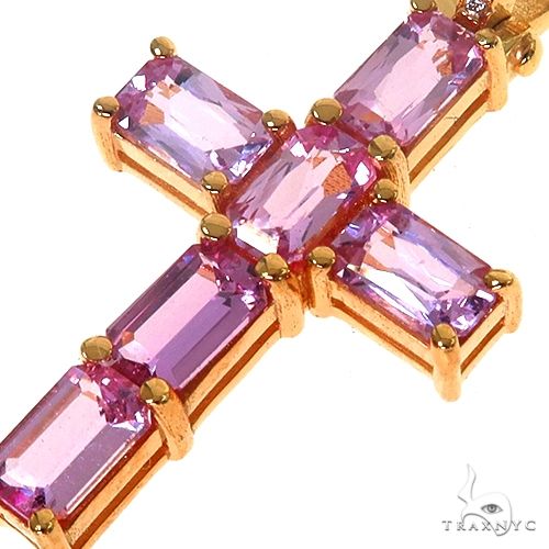Rose gold cross pendant with pink emerald-cut sapphire gemstones in prong settings