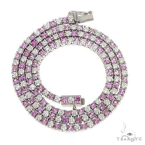 Pink sapphire and diamond tennis chain necklace in rose gold setting, elegant clasp detail