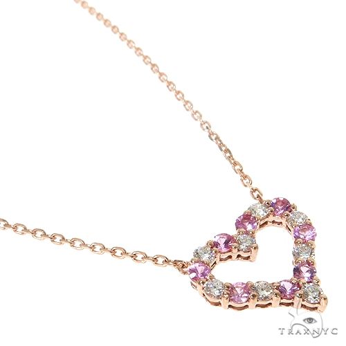 Heart-shaped necklace with alternating pink sapphires and diamonds on rose gold chain