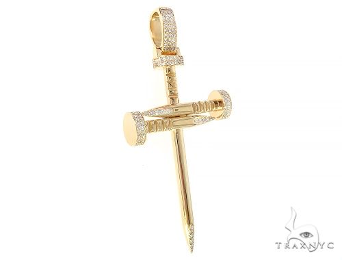 Yellow gold cross pendant designed like a nail with prong-set diamonds on the arms