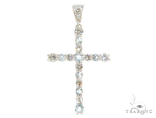 White gold cross pendant with prong-set diamonds and aquamarine gemstones