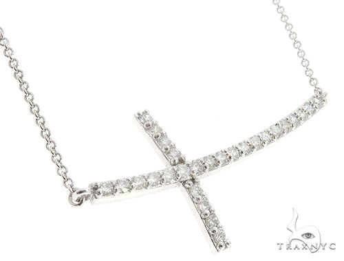 White gold prong-set diamond cross pendant on a delicate chain, men's and women's unisex design