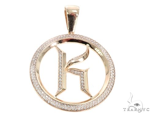 Diamond initial letter K pendant in 10k yellow gold with round prong-set stones, front view