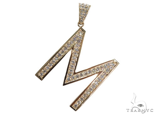 Yellow gold diamond-encrusted letter M pendant with prong setting and diamond bail