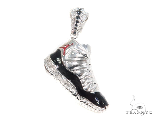 White gold sneaker pendant with prong-set diamonds and black enamel accents