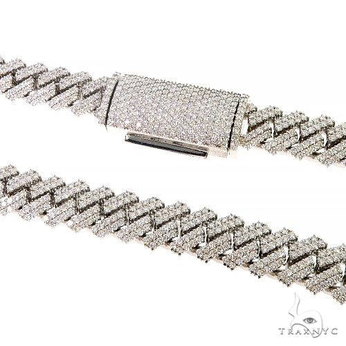 Prong set diamond Cuban link chain, yellow gold – close-up showing raised diamond prong settings across each link