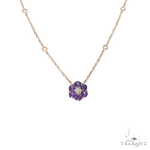 Yellow gold necklace with purple sapphire flower pendant and central diamond detail