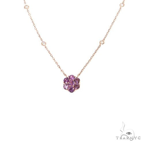 Yellow gold necklace with purple sapphire and diamond flower pendant