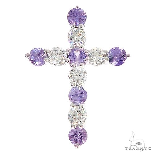 Purple sapphire and diamond cross pendant with white gold prongs in symmetrical design