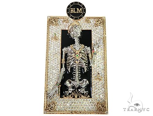 Diamond skeleton figure pendant in yellow gold tone – fully iced round-cut diamonds covering figure, front view