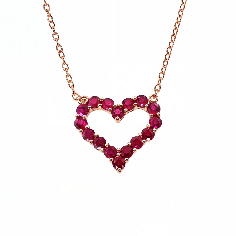 Yellow gold necklace with heart-shaped ruby gemstone pendant