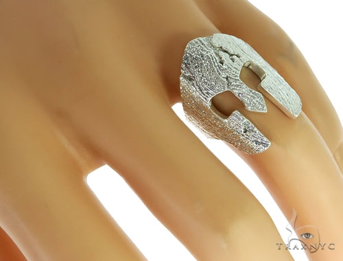 Silver Spartan helmet-shaped ring with textured surface and prong-set diamond accents