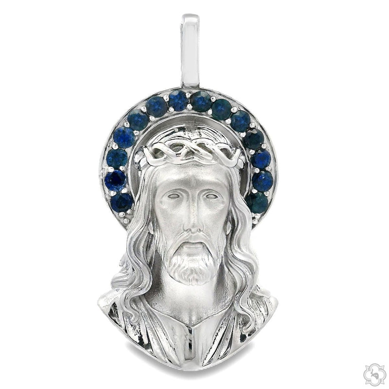 Silver Jesus face pendant with sapphire halo stone border, front-facing view
