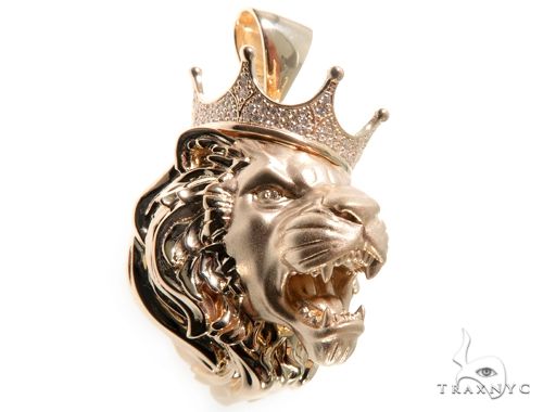 Yellow gold lion head pendant with diamond-studded crown, detailed mane, and fierce expression