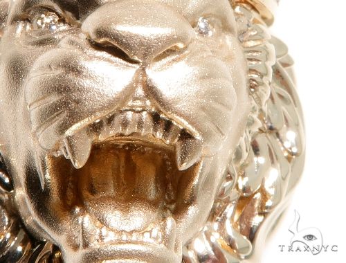Close-up of men's white gold lion head pendant with diamond accents, fierce open mouth design