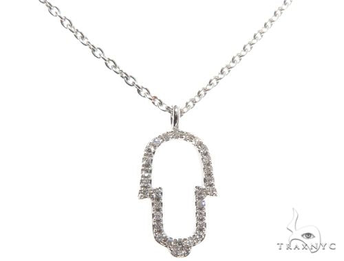 Small white gold Hamsa hand pendant necklace with diamond accents on delicate chain