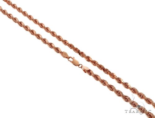14k rose gold solid rope chain 4mm – close-up of interlocking twist links showing warm blush tone