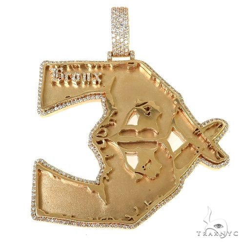 mens diamond logo pendant in 14k gold — front-facing view showing diamond-set logo silhouette