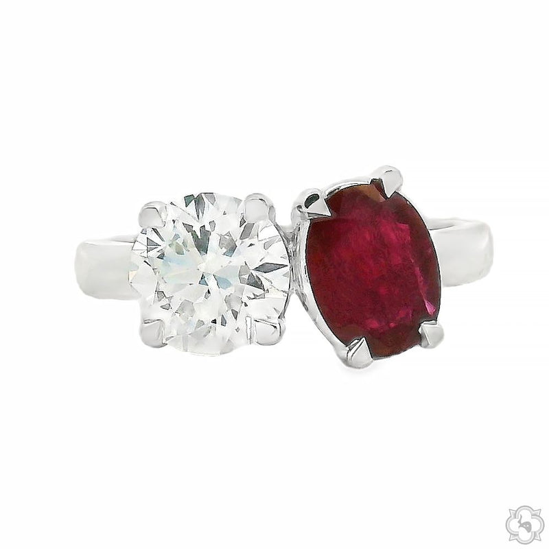 Yellow gold Toi et Moi ring with oval ruby and round diamond gemstones