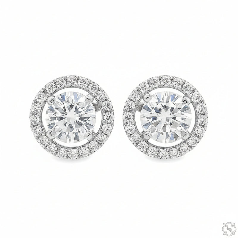 Yellow gold diamond stud earrings with halo setting and round center stones