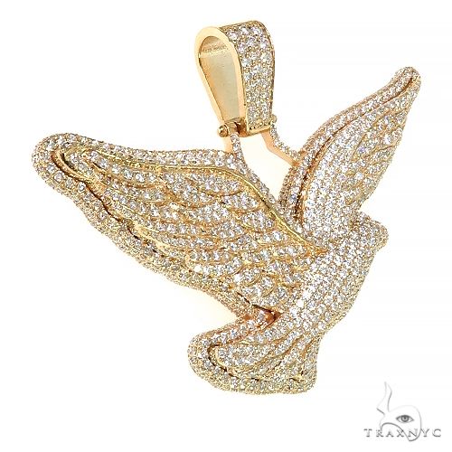 Yellow gold dove pendant encrusted with sparkling diamonds, detailed wings and body design