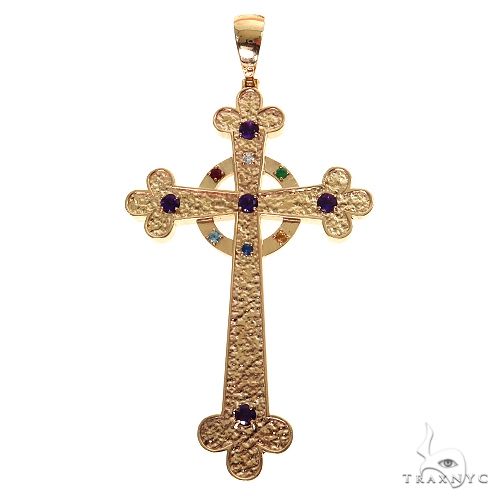 Yellow gold cross pendant with purple gemstones and textured finish