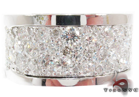 Wide white gold men's band encrusted with multiple sparkling diamonds