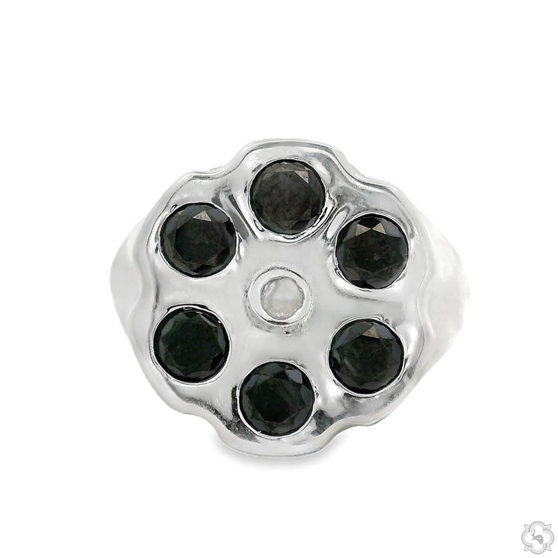 Silver revolver cylinder ring with six black diamonds and one small clear stone center