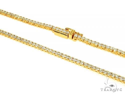 14K yellow gold tennis chain with round diamond 2 pointer accents, elegant unisex design