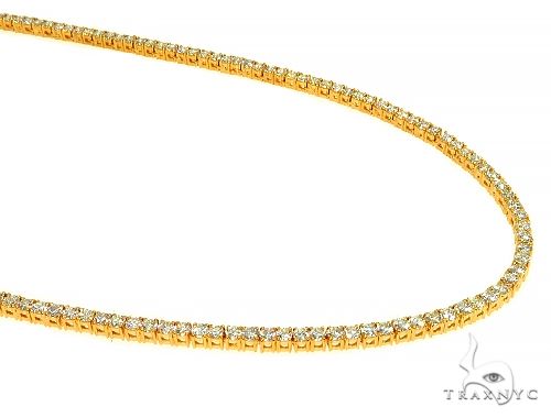 14K yellow gold diamond tennis chain with four-prong round stone settings – front detail view