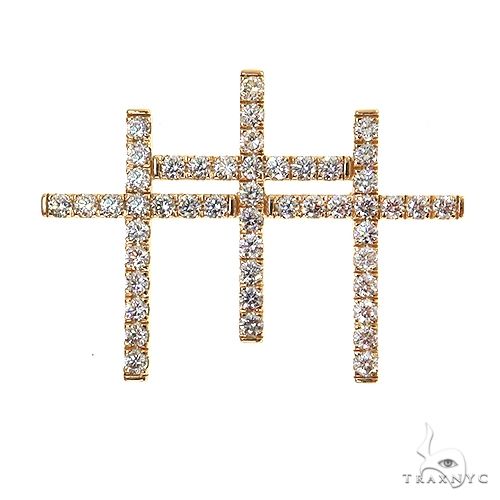 Yellow gold triple cross pendant encrusted with round sparkling diamonds