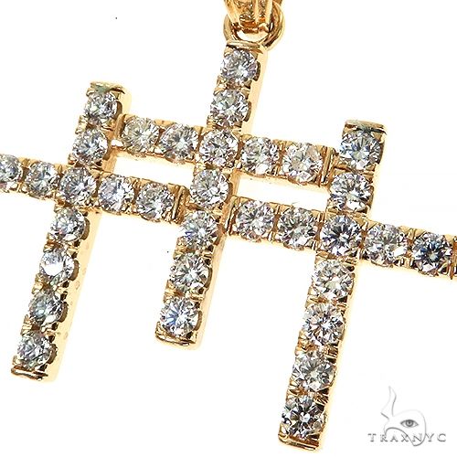 Yellow gold triple cross pendant encrusted with round brilliant diamonds