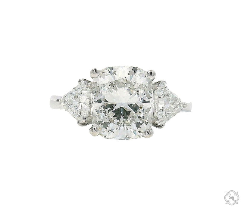 Three-stone cushion cut diamond engagement ring – cushion center stone with side diamond accents, front-facing view