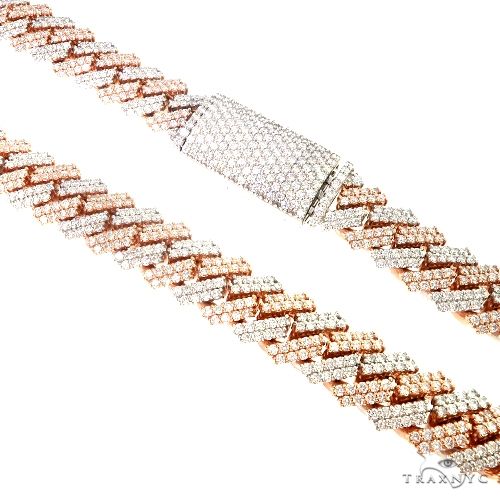 Two tone prong set diamond Cuban link chain – alternating metal tones with individually prong-set diamonds, flat lay view