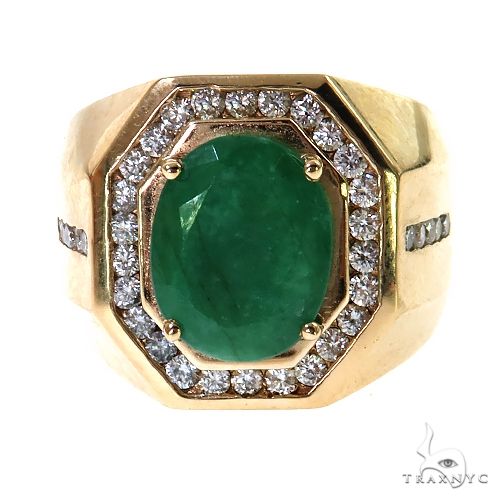 Yellow gold men's ring with oval emerald center surrounded by small diamonds