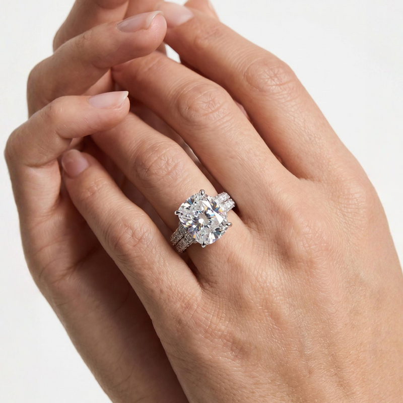 White gold engagement ring with large center diamond and smaller surrounding stones