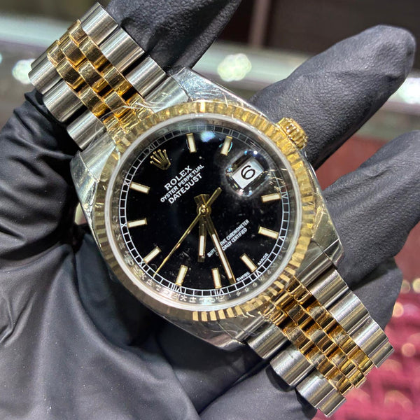 2011 Rolex Datejust 36mm in two tone Oystersteel and 18K yellow gold with a black stick dial and fluted bezel, ref 116233