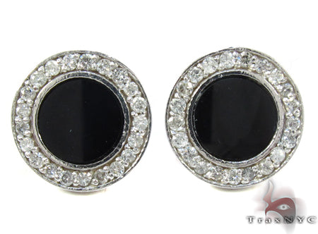 White gold round earrings with black onyx center and prong-set diamond halo