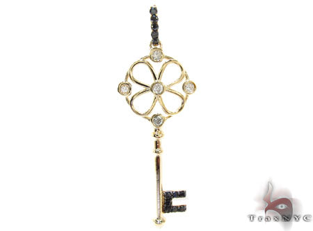 Diamond key pendant in 14k yellow gold with round cut bezel and prong settings, front view