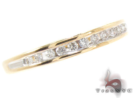Slim 14K yellow gold band with small channel-set round diamonds