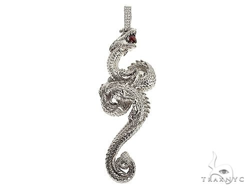 Detailed 3D silver dragon pendant with red gemstone eyes and textured scales