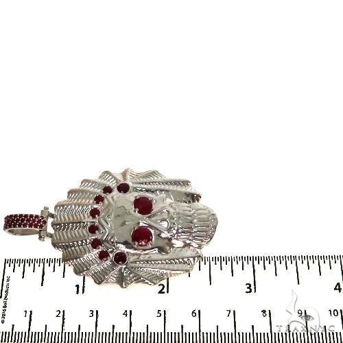 Sterling silver Indian skull pendant with red ruby stones and feather detailing