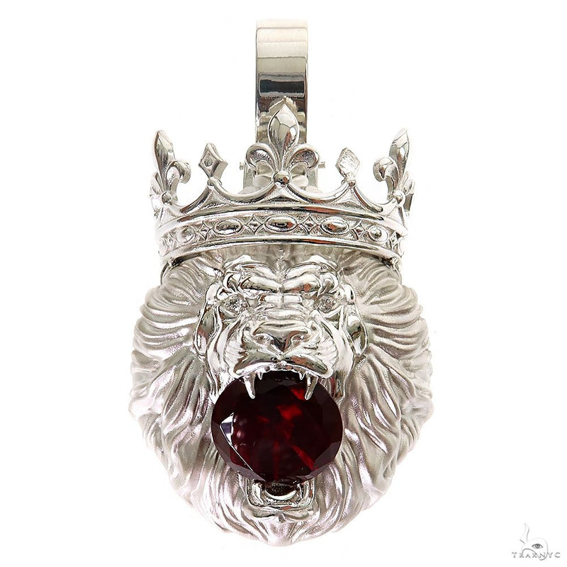 Sterling silver lion head pendant with crown and deep red gemstone in mouth