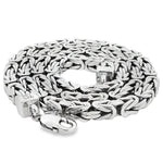 Close-up of a shiny .925 silver Byzantine link chain with 6.2mm thickness and lobster clasp.