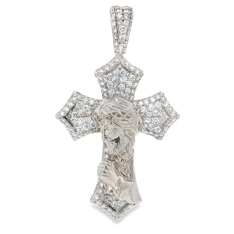 White gold cross pendant with praying Jesus and diamond accents.