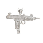 Sterling silver gun-shaped pendant with detailed grip and barrel design.