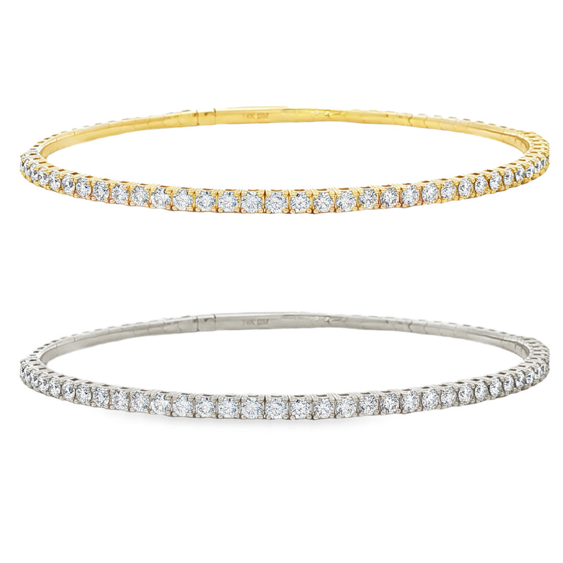 Yellow gold flexible bangle bracelet with a single row of round diamonds.
