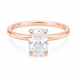 14K gold engagement ring featuring a 1.50 carat oval lab grown diamond in a four-prong setting with a hidden halo and a slim polished solitaire band.