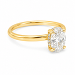 14K yellow gold engagement ring featuring a 1.50 carat oval lab grown diamond in a four-prong setting with a hidden halo and a slim polished solitaire band.