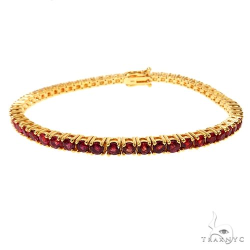 fire sapphire tennis bracelet with round-cut red sapphires in prong settings, full 7.5-inch view